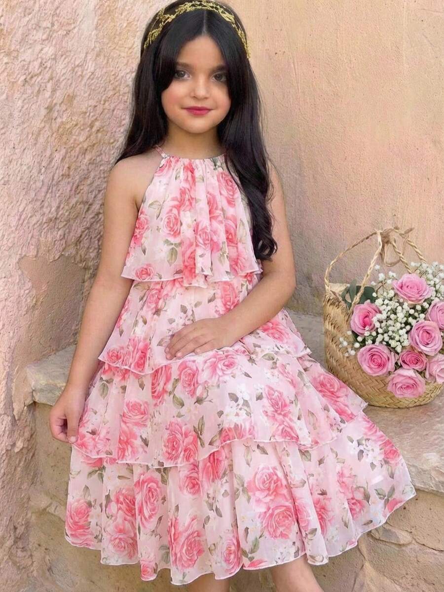 Apricot all-over floral print midi dress for tween girls featuring a sleeveless V-neckline, high waist, button details, and tiered A-line skirt.