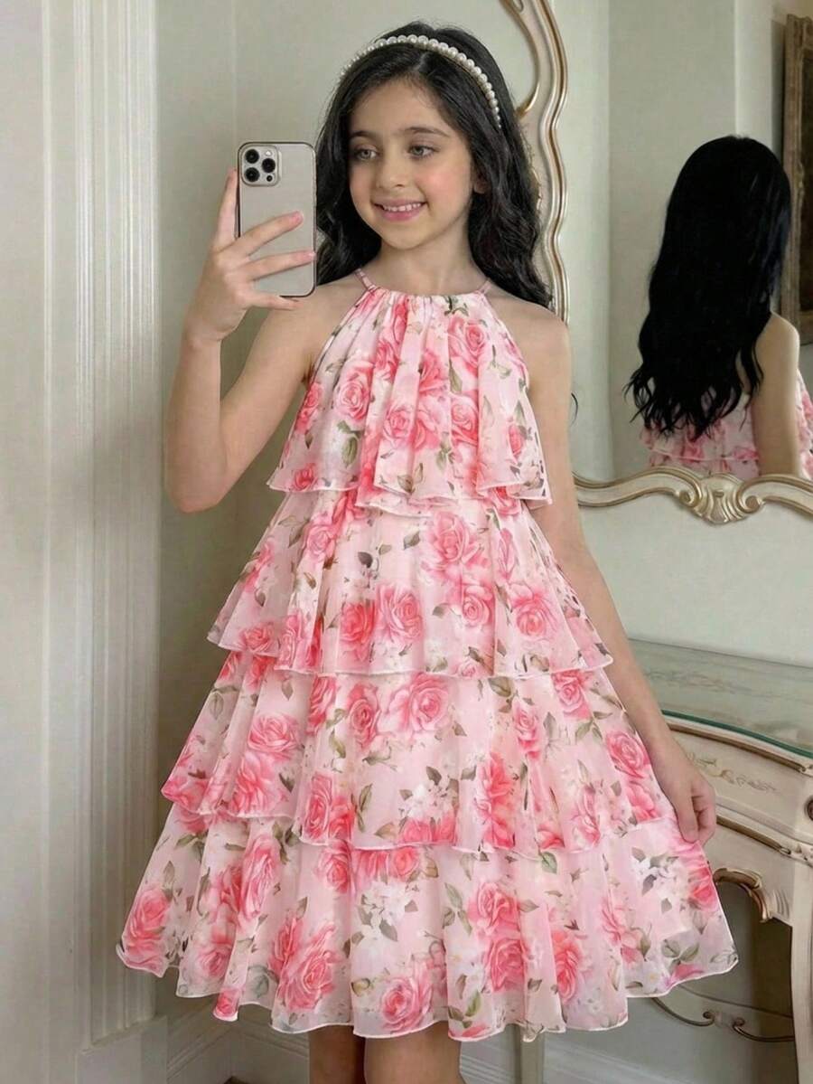 Apricot all-over floral print midi dress for tween girls featuring a sleeveless V-neckline, high waist, button details, and tiered A-line skirt.