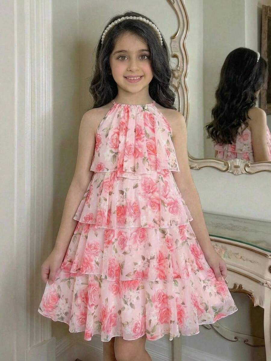 Apricot all-over floral print midi dress for tween girls featuring a sleeveless V-neckline, high waist, button details, and tiered A-line skirt.