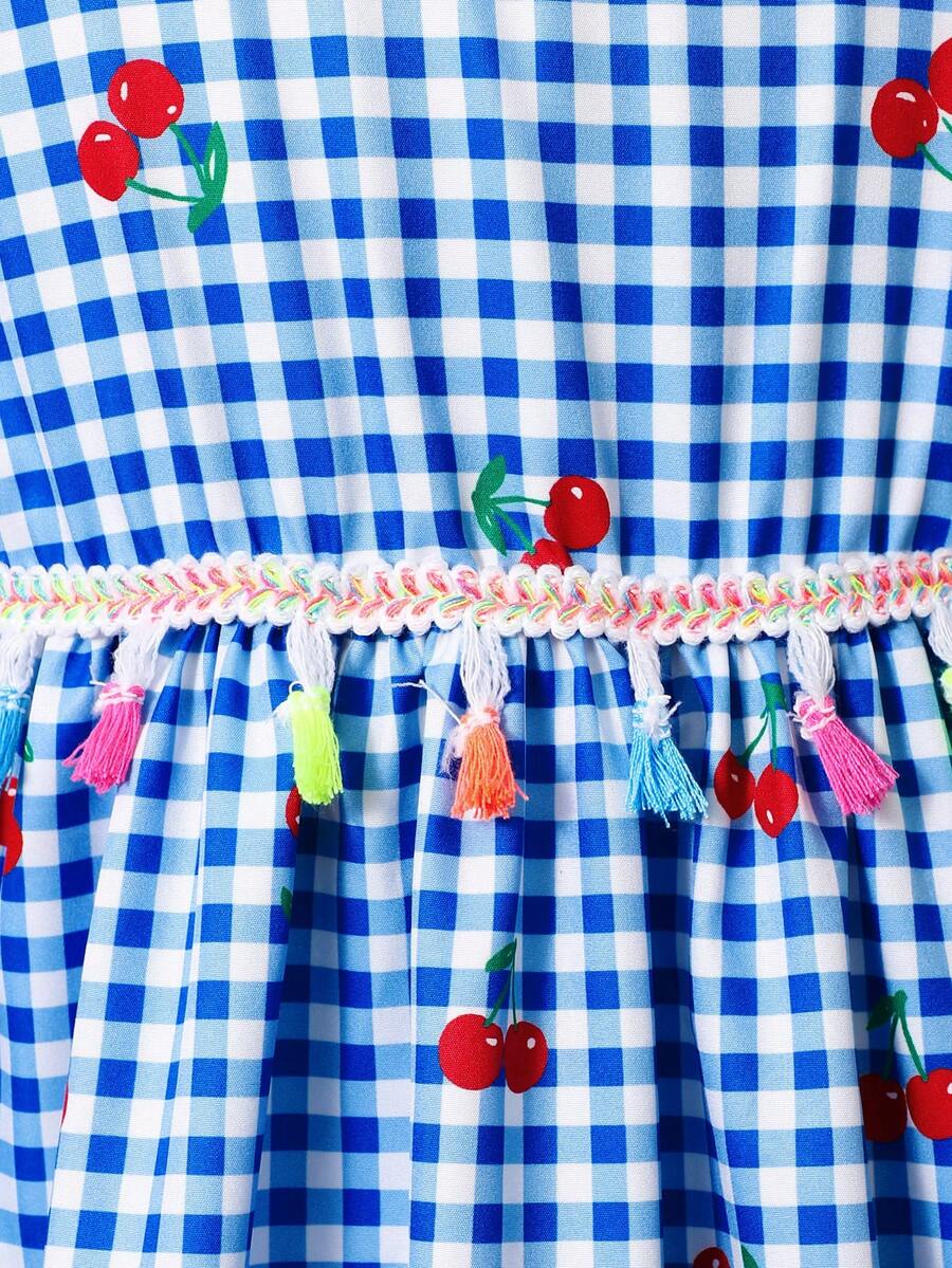Tween girls blue short smock dress featuring flounce short sleeves, high waist flared hem, round neck, and front bow detail.