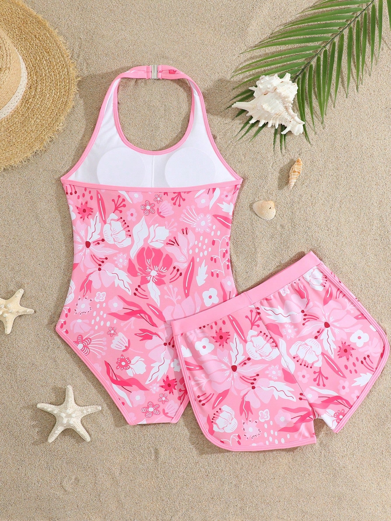 Girls 2-piece swimwear set featuring a butterfly print halter swimsuit top with contrast piping and separate mid-waist shorts; sleeveless, high-stretch, wireless design for beach and vacation wear.