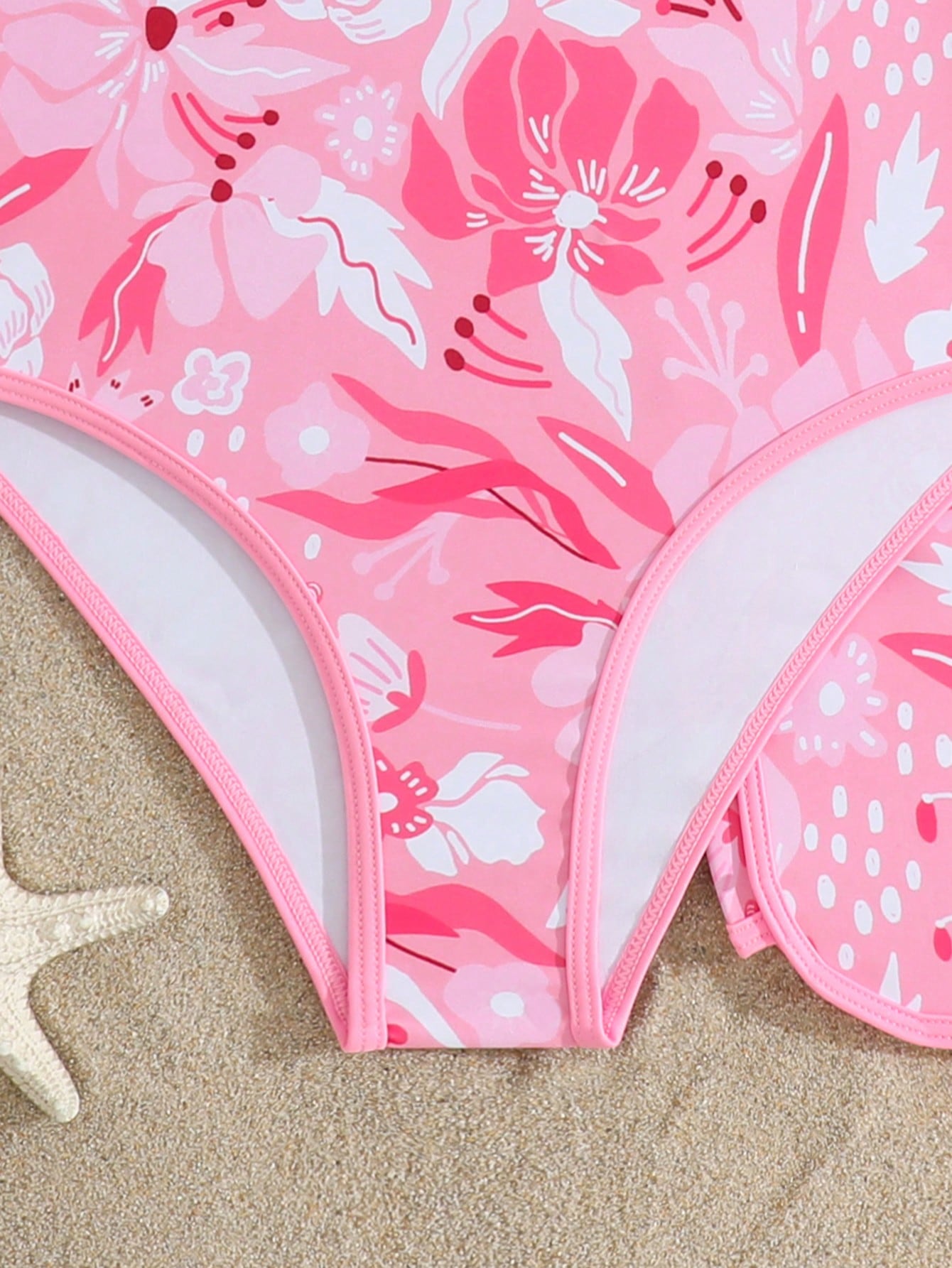 Girls 2-piece swimwear set featuring a butterfly print halter swimsuit top with contrast piping and separate mid-waist shorts; sleeveless, high-stretch, wireless design for beach and vacation wear.
