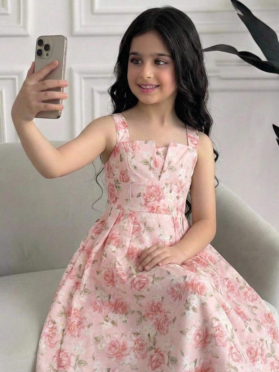 Tween girl apricot floral print midi dress with ruffle shoulder straps, shirred detail, and high waist A-line fit.
