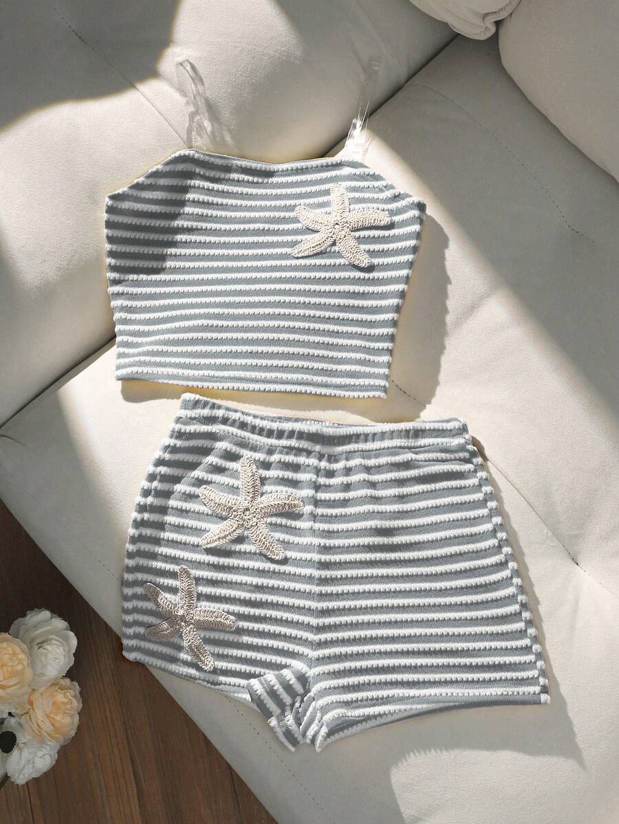 Tween girls black and white striped two-piece set featuring a spaghetti strap micro crop tank top with lettuce trim and ruffle hem paired with matching slim fit shorts.