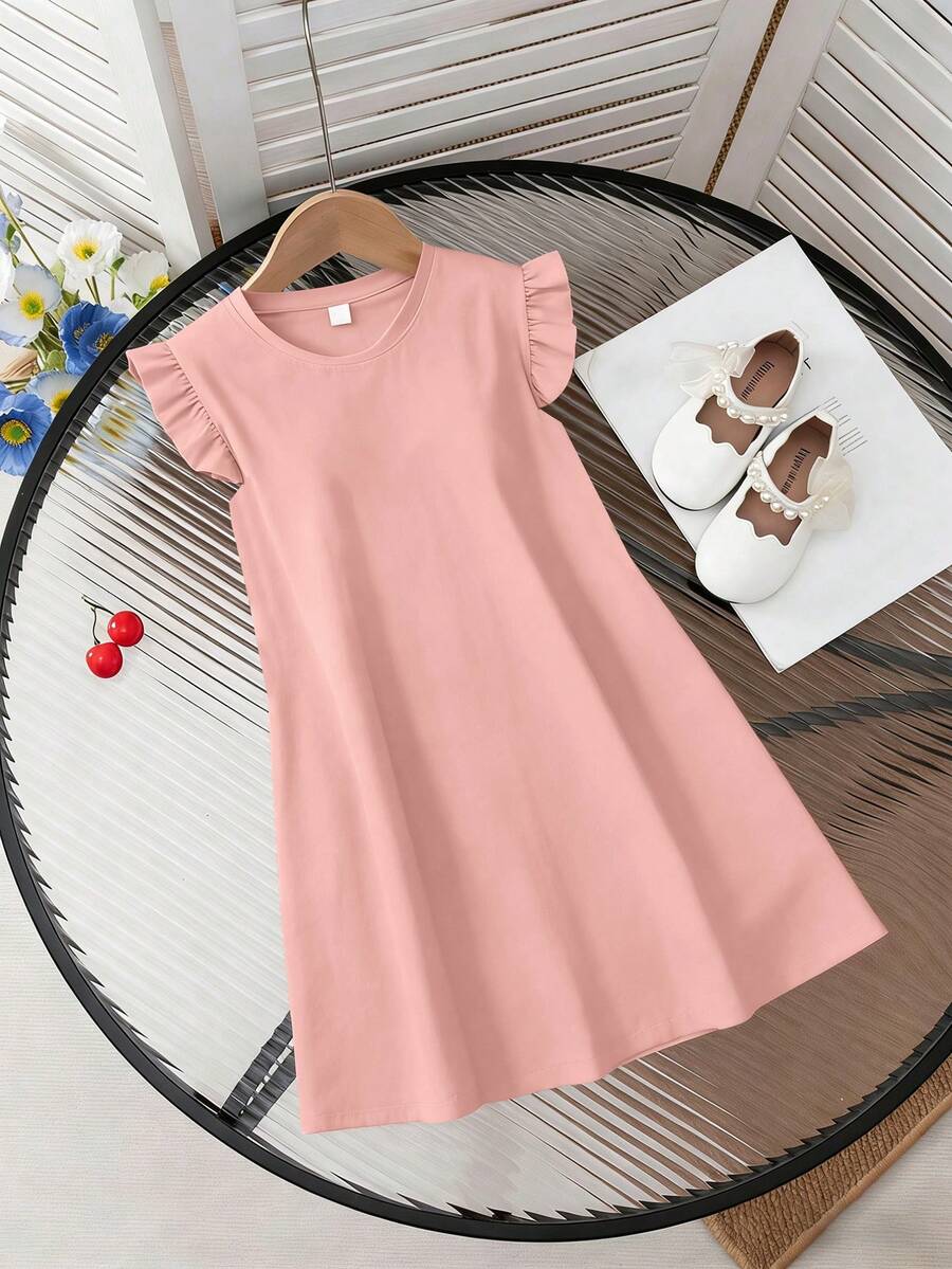 Girls black ruffle sleeve midi dress featuring a loose fit tunic silhouette, round neckline, button details, and short flounce sleeves.