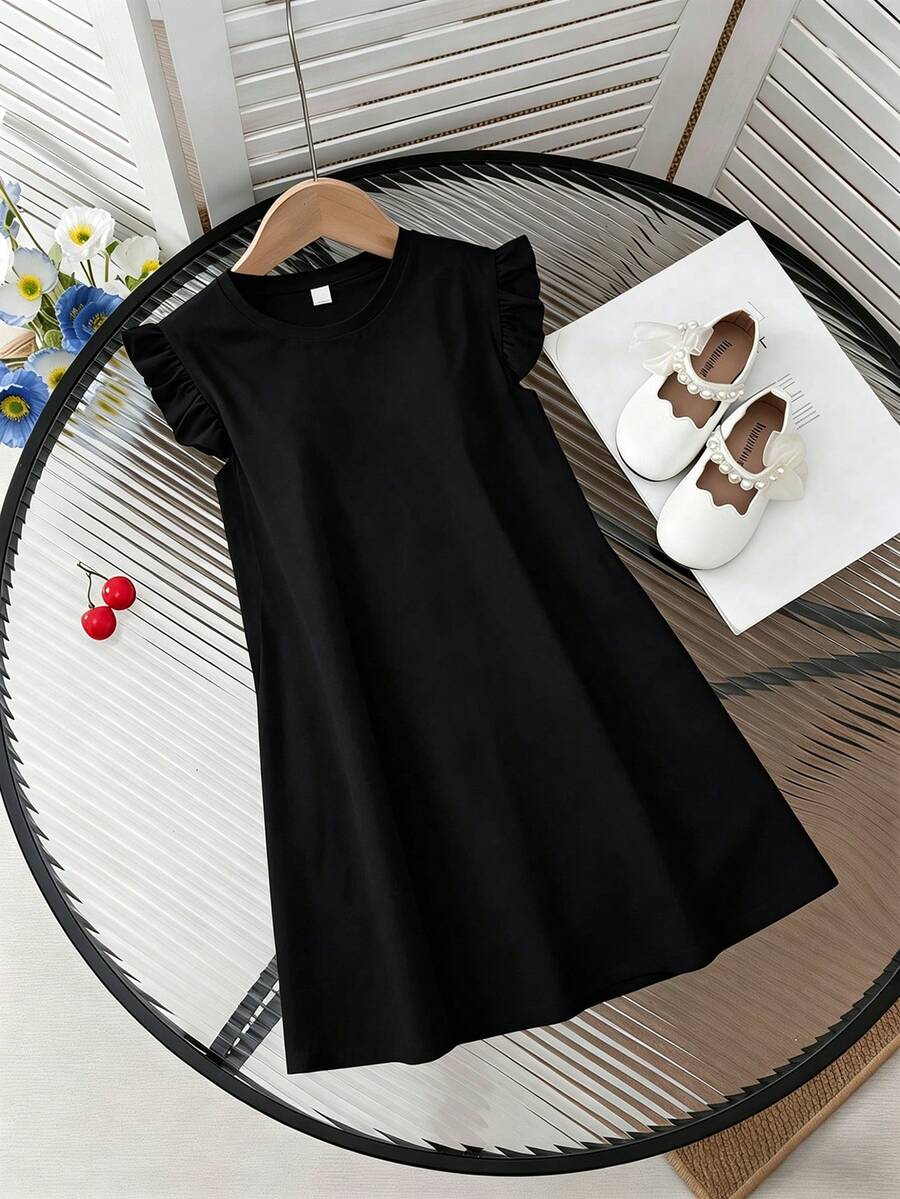 Girls black ruffle sleeve midi dress featuring a loose fit tunic silhouette, round neckline, button details, and short flounce sleeves.
