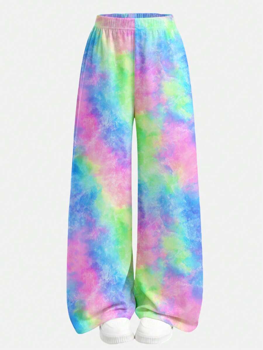 Tween girl 2-piece summer set featuring a white printed short-sleeve T-shirt and black and white striped long pants.