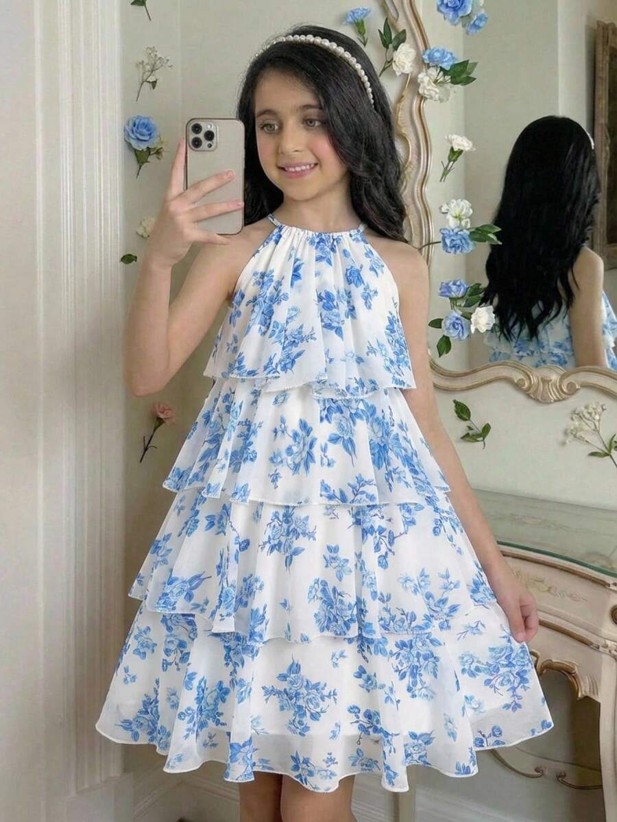 Apricot all-over floral print midi dress for tween girls featuring a sleeveless V-neckline, high waist, button details, and tiered A-line skirt.