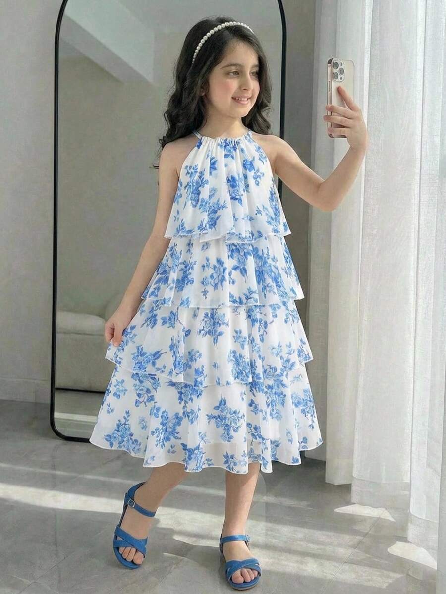 Apricot all-over floral print midi dress for tween girls featuring a sleeveless V-neckline, high waist, button details, and tiered A-line skirt.