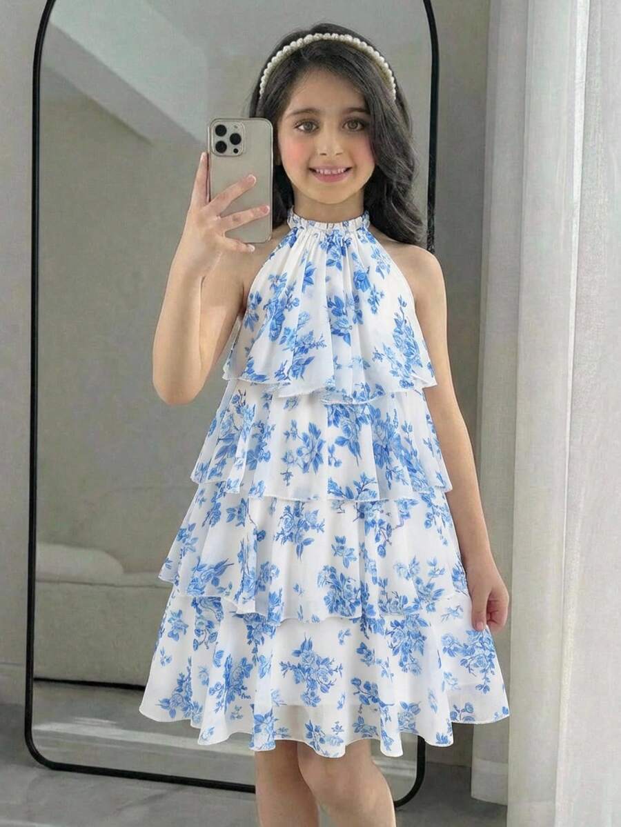 Apricot all-over floral print midi dress for tween girls featuring a sleeveless V-neckline, high waist, button details, and tiered A-line skirt.