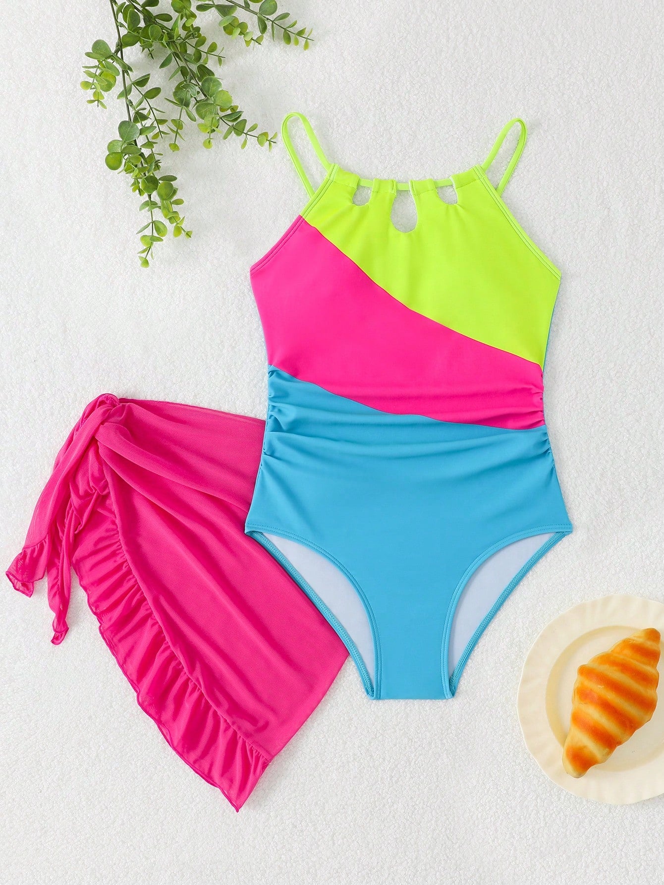 Girls black and white one-piece swimsuit set with cut-out detail, spaghetti straps, sleeveless fitted design, and matching skirt bottom for vacation swimwear.