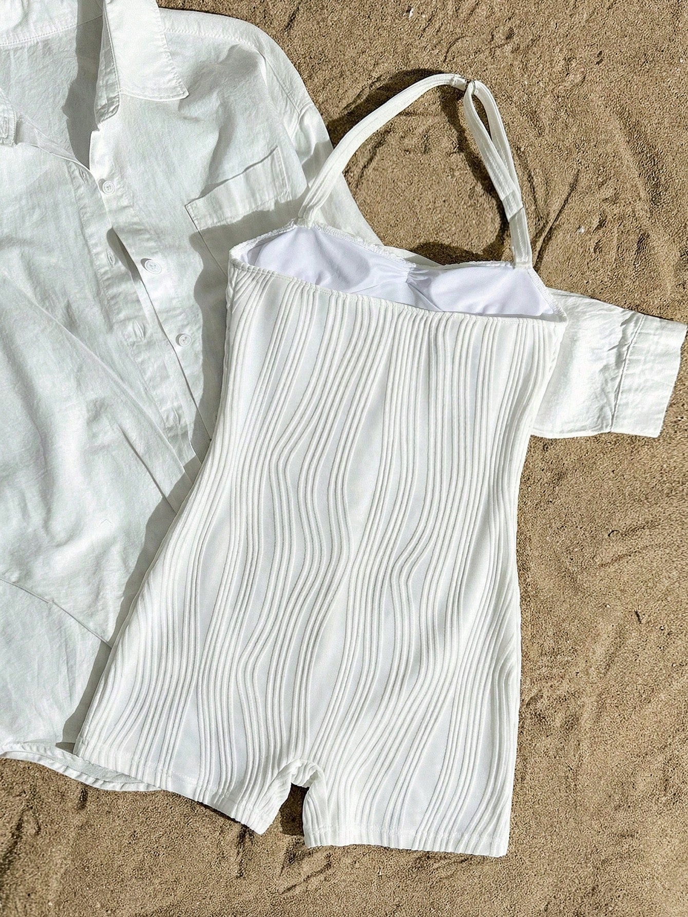 Apricot one-piece swimsuit for tween girls with a halter neckline, ruffle trim, textured knit fabric, fitted shape, and starfish metal decor.