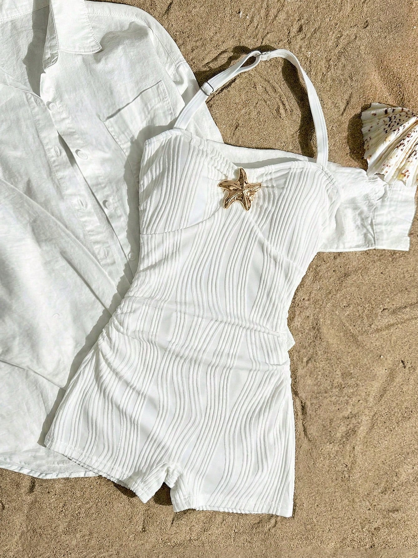 Apricot one-piece swimsuit for tween girls with a halter neckline, ruffle trim, textured knit fabric, fitted shape, and starfish metal decor.