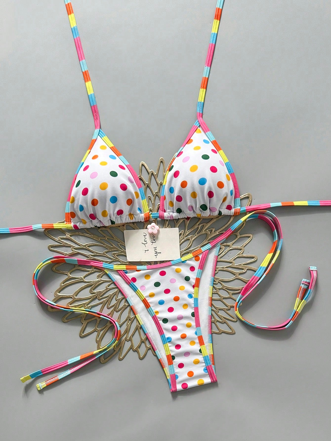 Apricot 2-piece bikini swimwear set featuring a textured halter triangle cup top with knot details and matching tie-side bottoms for women.
