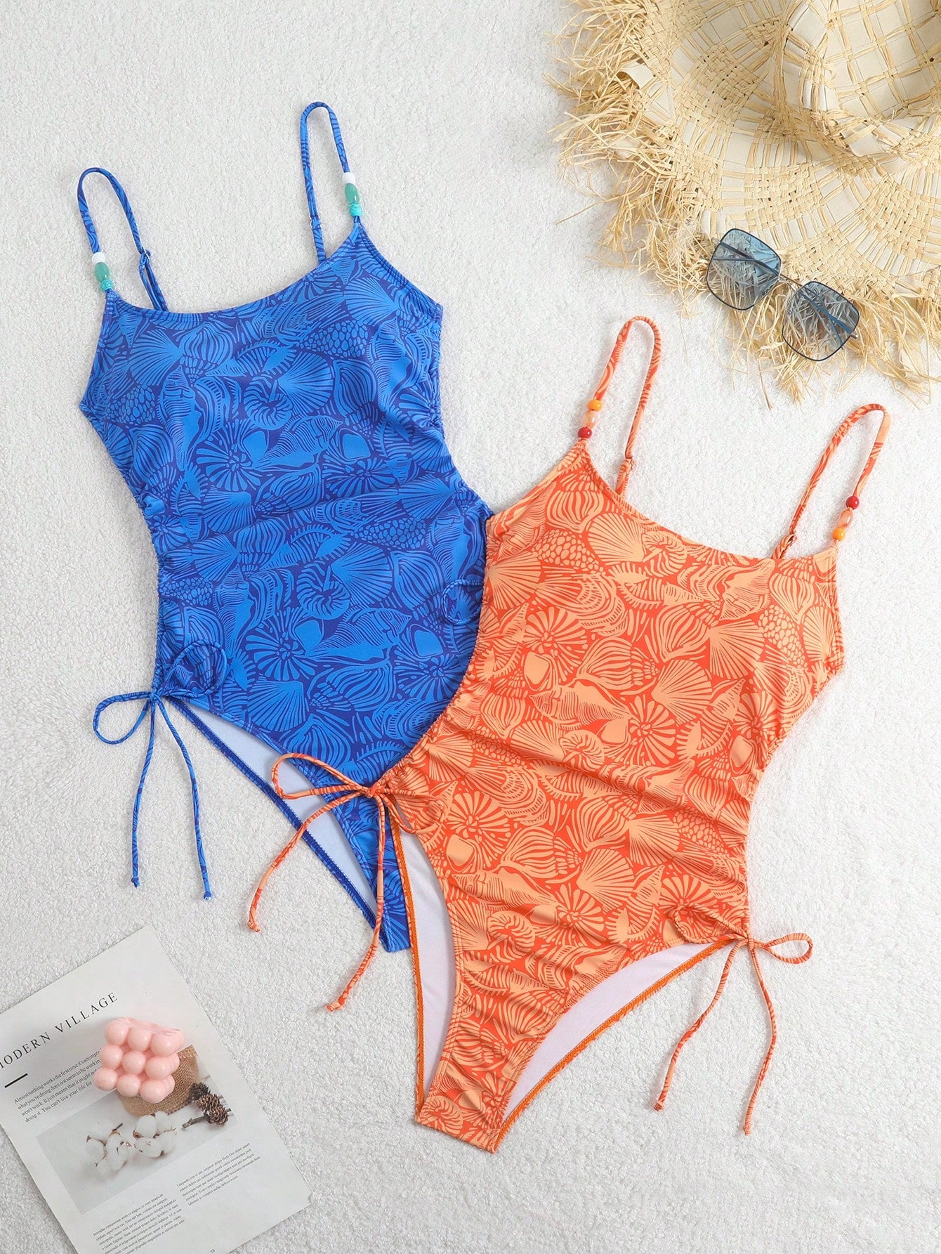 Women's blue backless one-piece swimsuit featuring spaghetti straps, wireless bra with removable padding, and drawstring details.