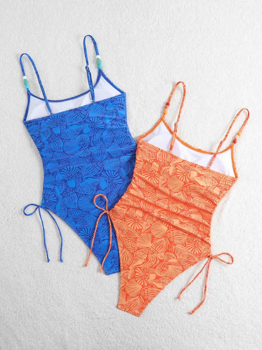 Women's blue backless one-piece swimsuit featuring spaghetti straps, wireless bra with removable padding, and drawstring details.