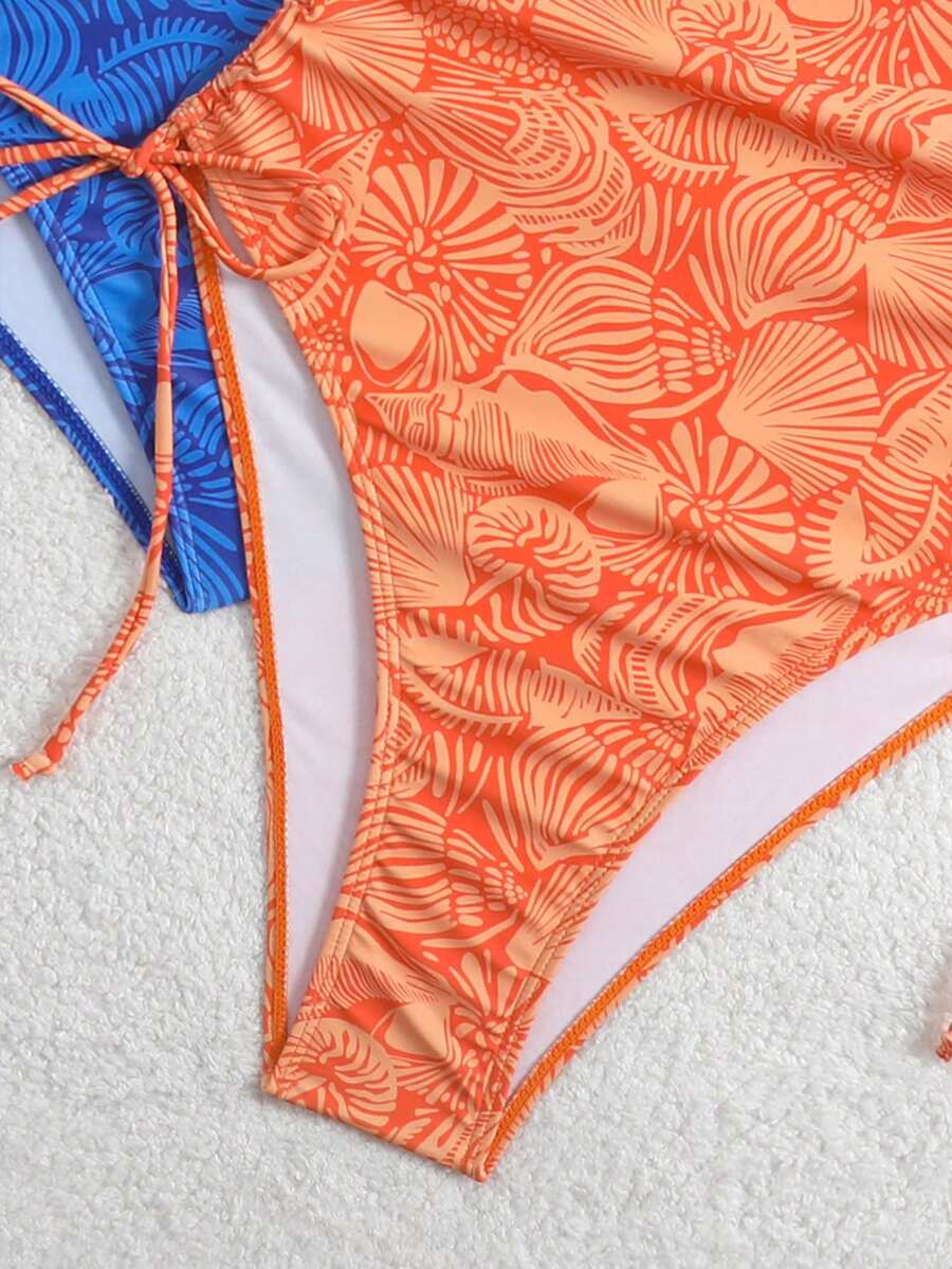 Women's blue backless one-piece swimsuit featuring spaghetti straps, wireless bra with removable padding, and drawstring details.