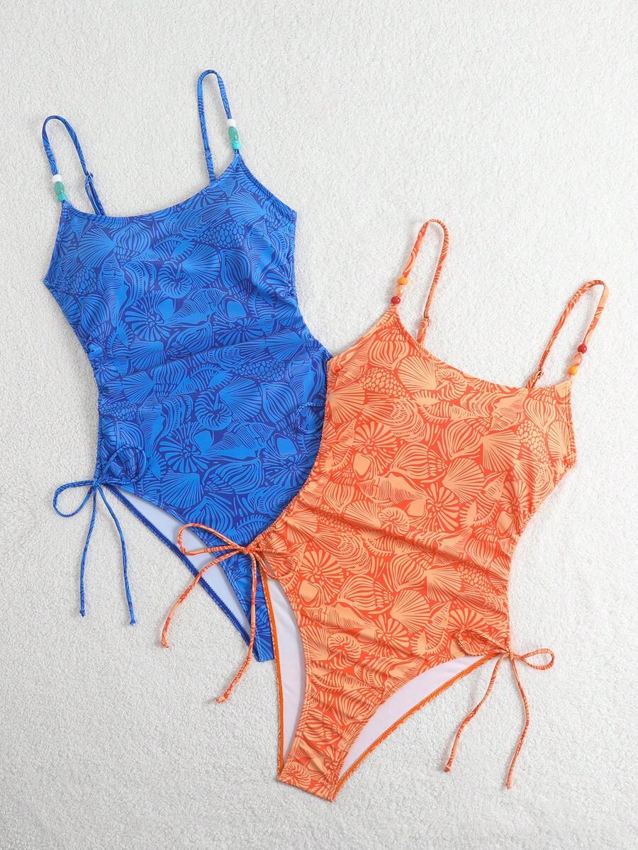 Women's blue backless one-piece swimsuit featuring spaghetti straps, wireless bra with removable padding, and drawstring details.