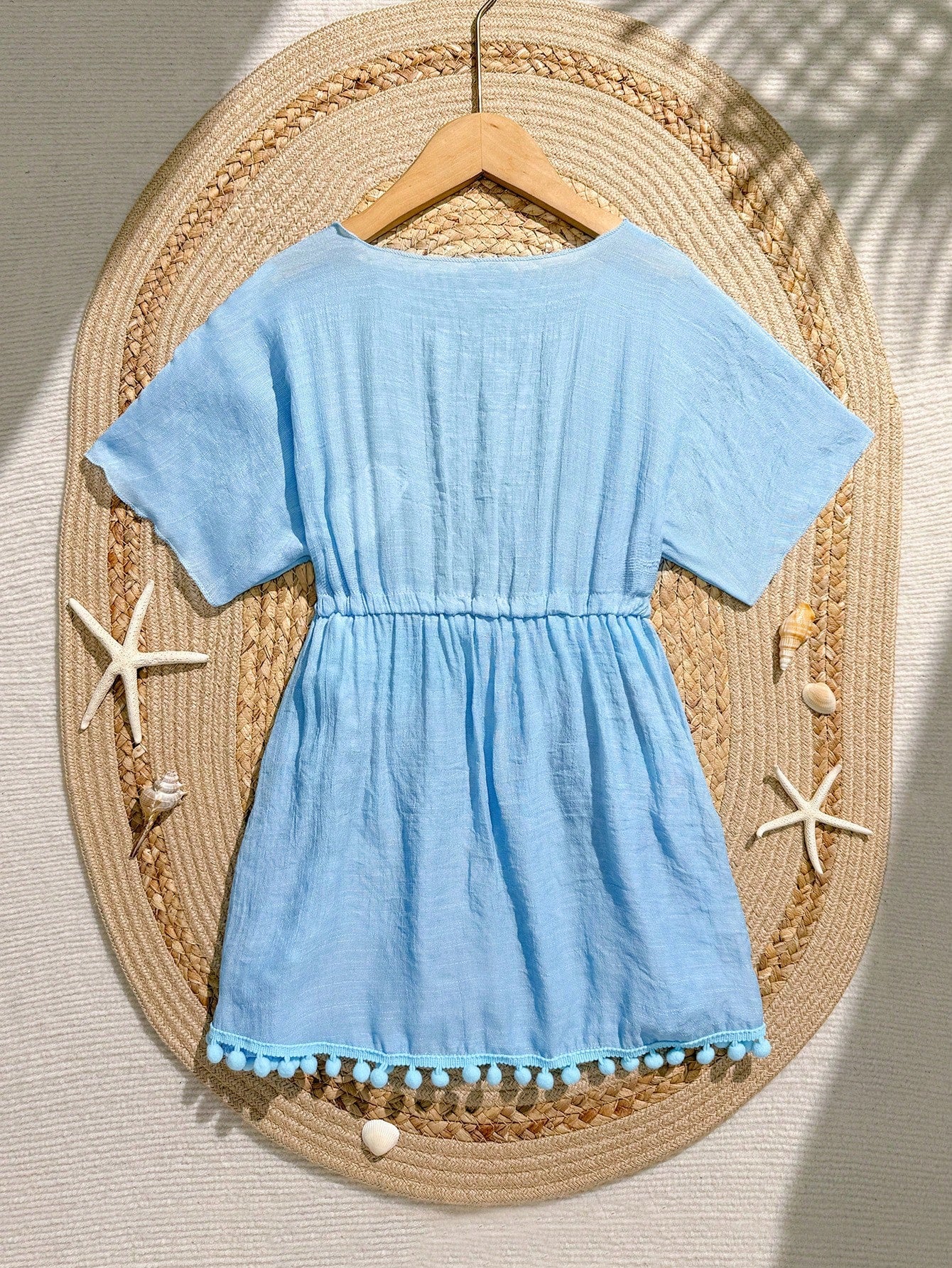 White tween girls swimsuit cover-up with V neck, short sleeves, contrast lace, fringe details, and regular length mesh fabric for beachwear
