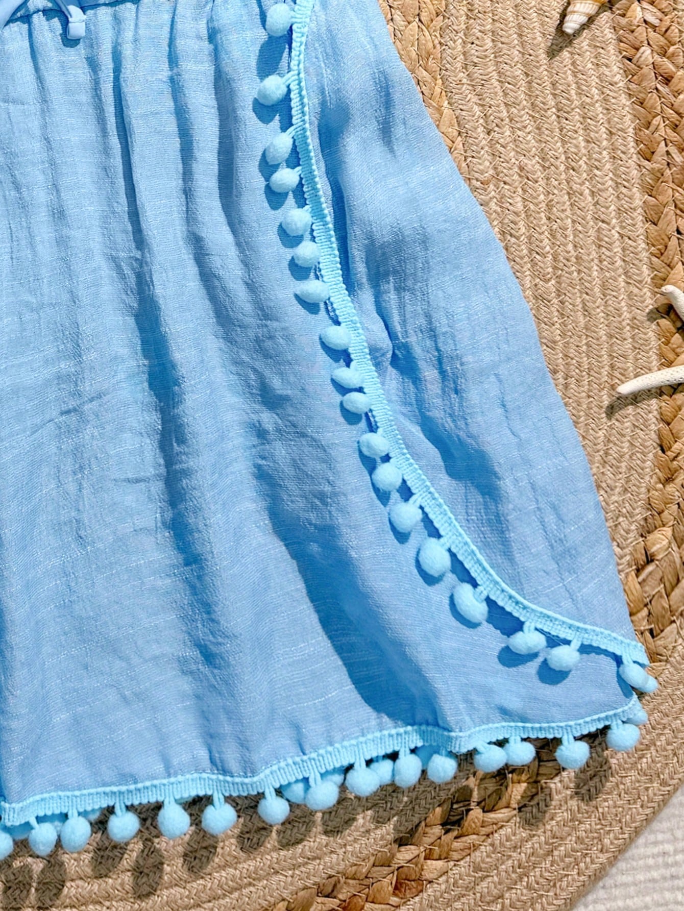 White tween girls swimsuit cover-up with V neck, short sleeves, contrast lace, fringe details, and regular length mesh fabric for beachwear