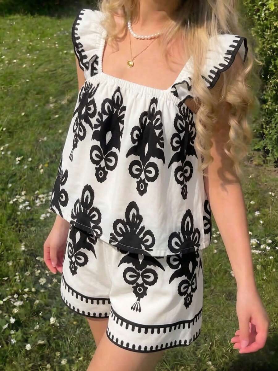 Tween girls 2-piece bohemian outfit set in apricot featuring a square neck embroidered sleeveless camisole top and matching floral wide leg shorts.