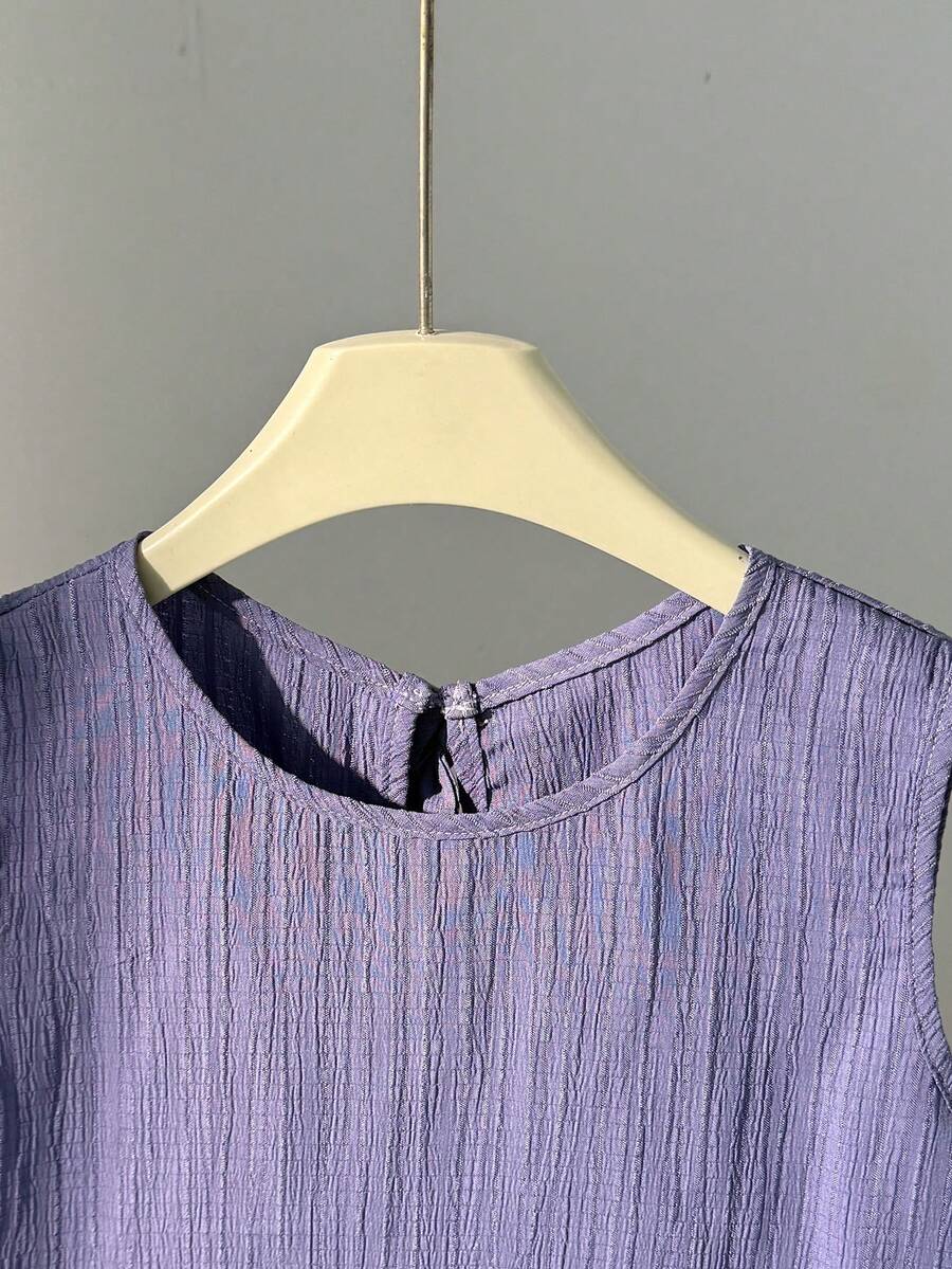 Tween girls casual blue tank top featuring round neck, textured fabric, and bow detail paired with matching shorts set.
