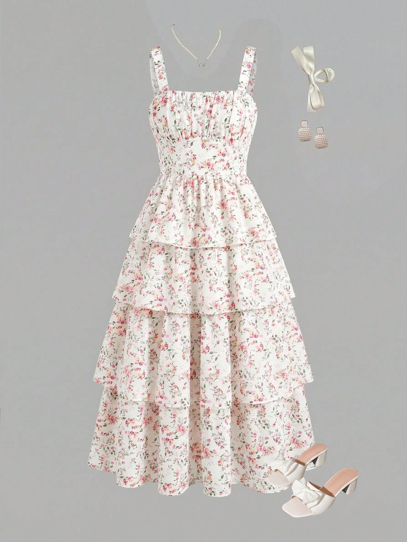 Tween girls blue ditsy floral sleeveless long dress with spaghetti straps, ruched bust, high waist, and tiered layered hem.