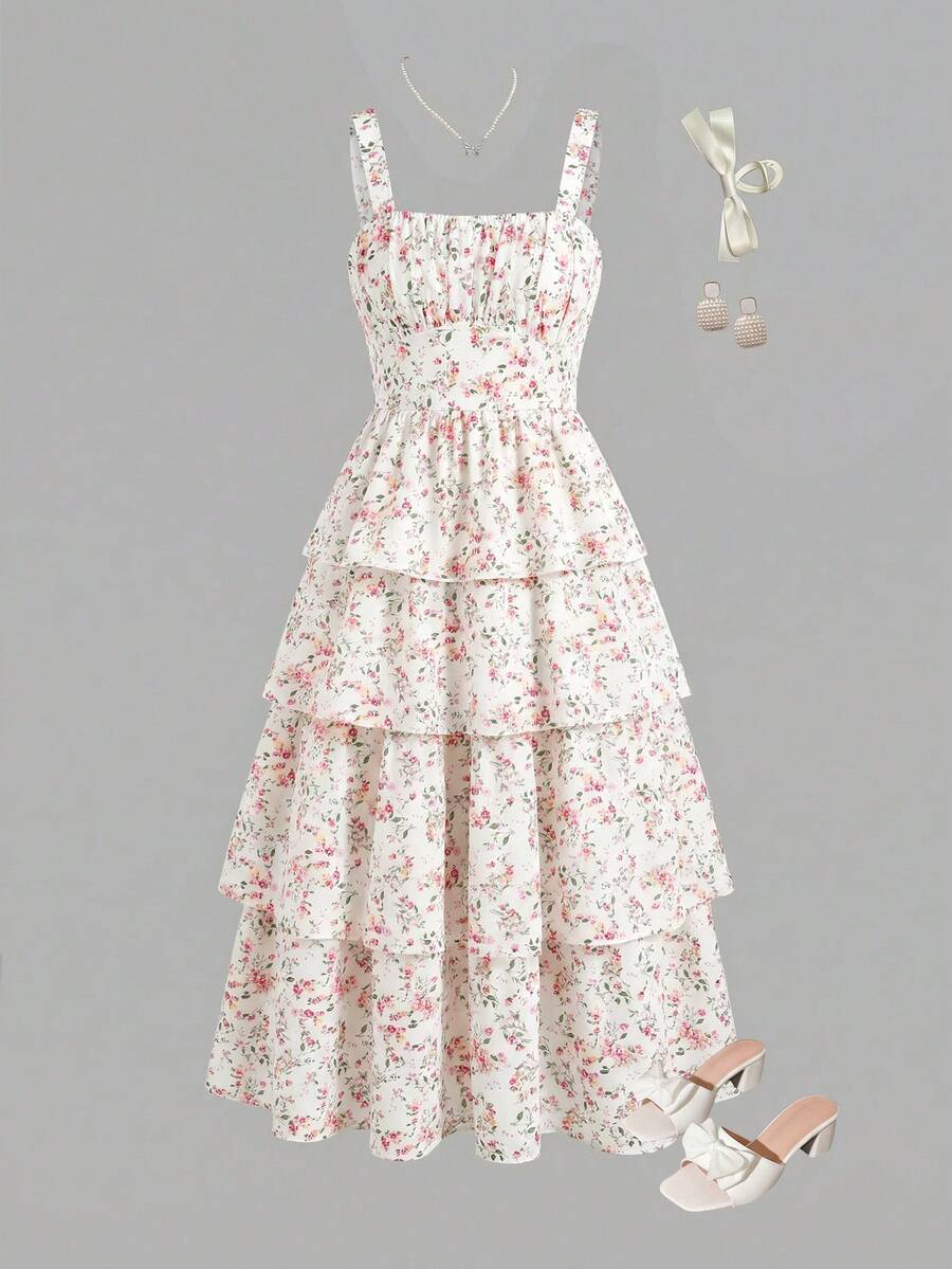 Tween girls blue ditsy floral sleeveless long dress with spaghetti straps, ruched bust, high waist, and tiered layered hem.