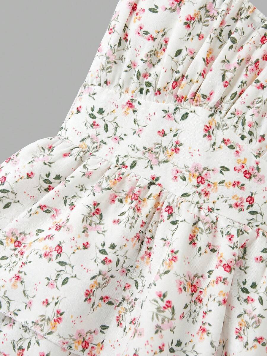 Tween girls blue ditsy floral sleeveless long dress with spaghetti straps, ruched bust, high waist, and tiered layered hem.