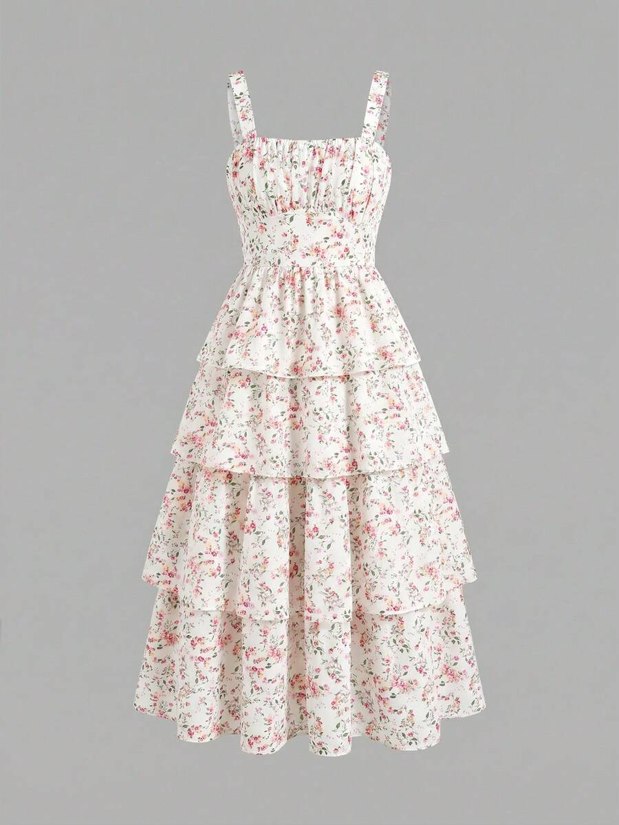 Tween girls blue ditsy floral sleeveless long dress with spaghetti straps, ruched bust, high waist, and tiered layered hem.