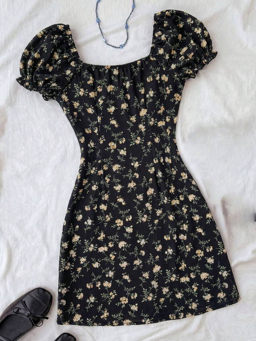 Black floral all-over print midi dress for tween girls featuring puff half sleeves, spaghetti strap neckline, and an A-line silhouette.