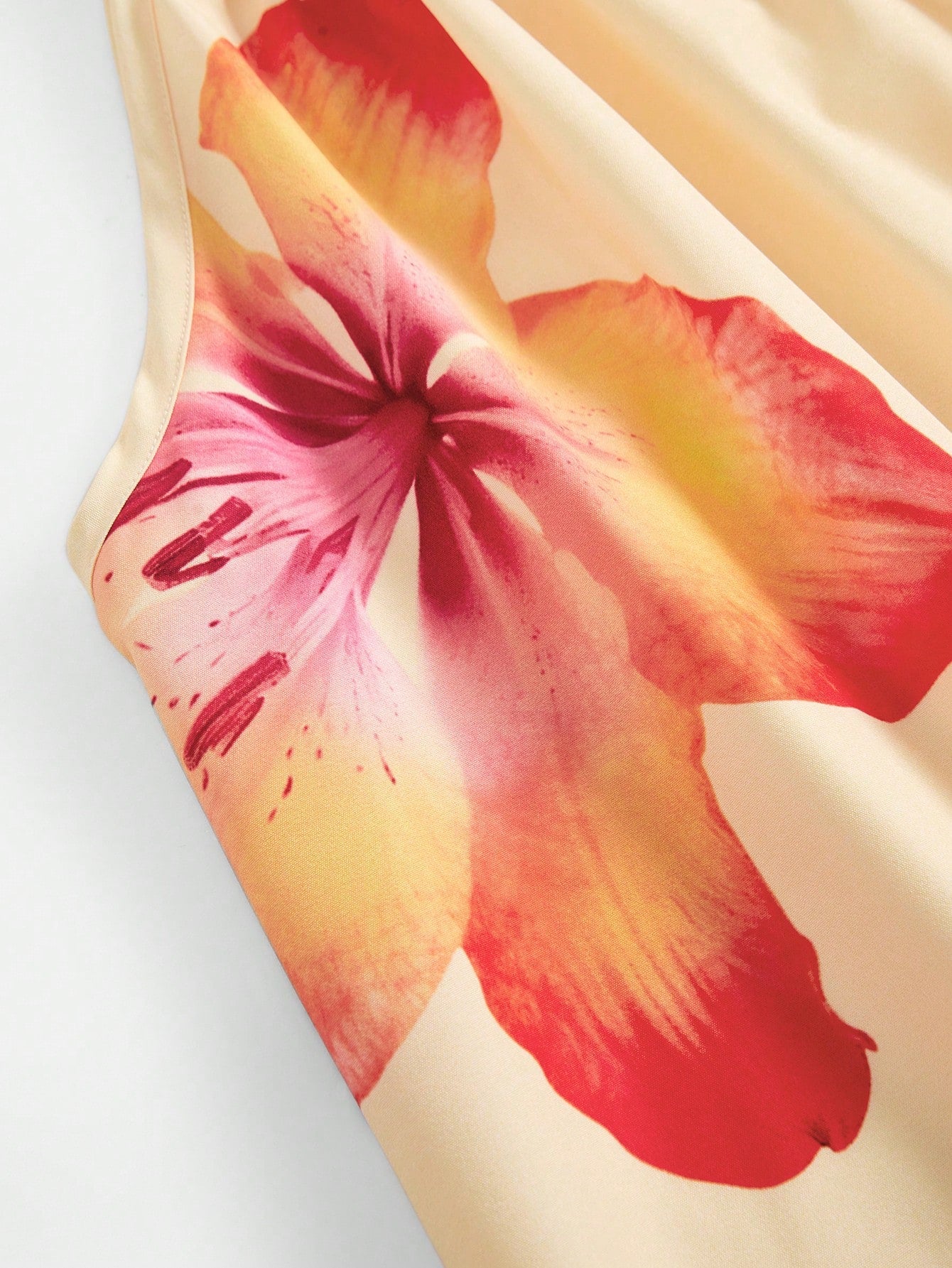 Tween girls floral print dress with halter neckline, sleeveless cold shoulder design, A-line shape, and vacation style.