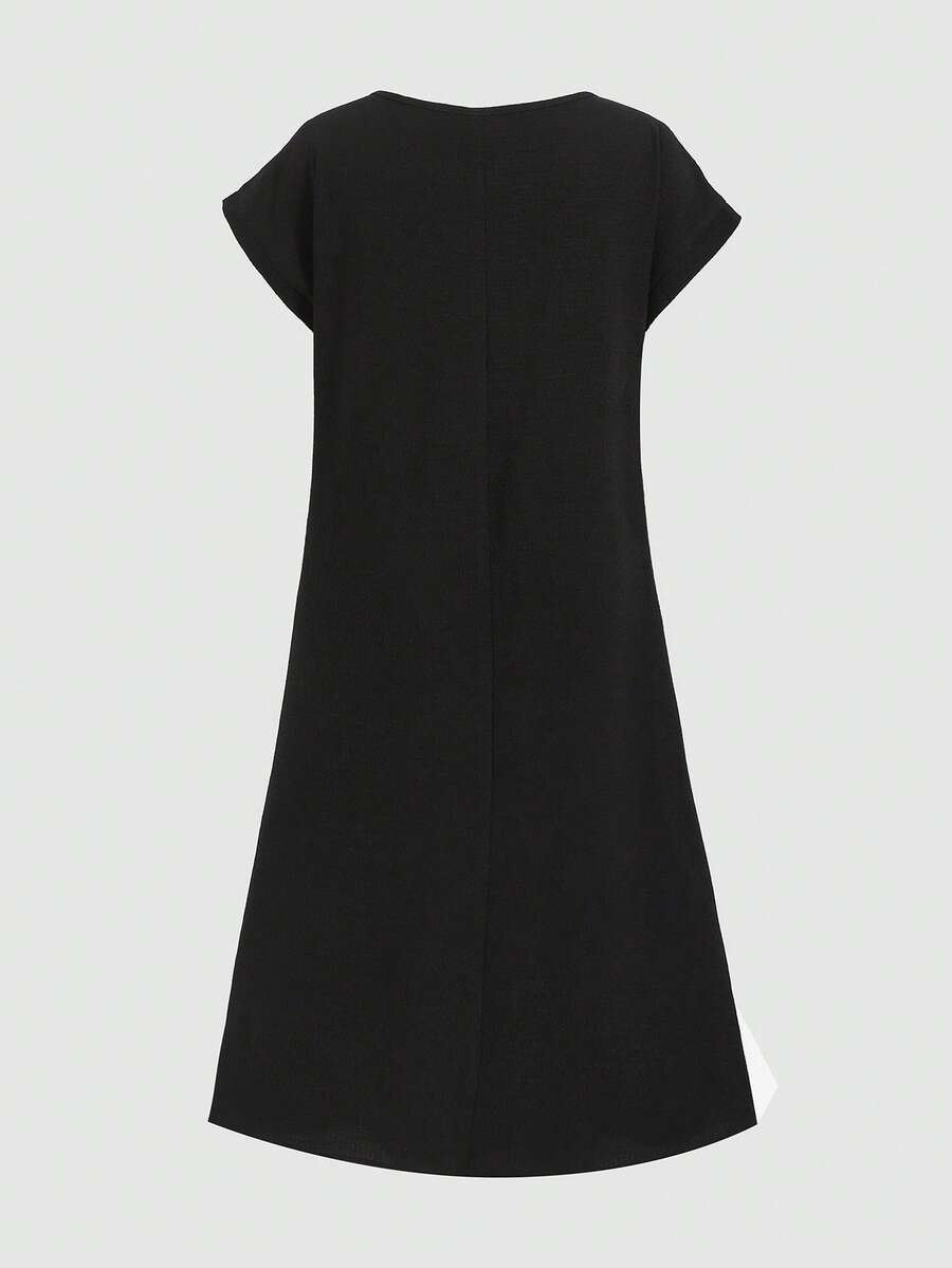 Tween girls casual black A-line long dress featuring short sleeves, a round neckline, and a decorative front bow with contrast lace trim.