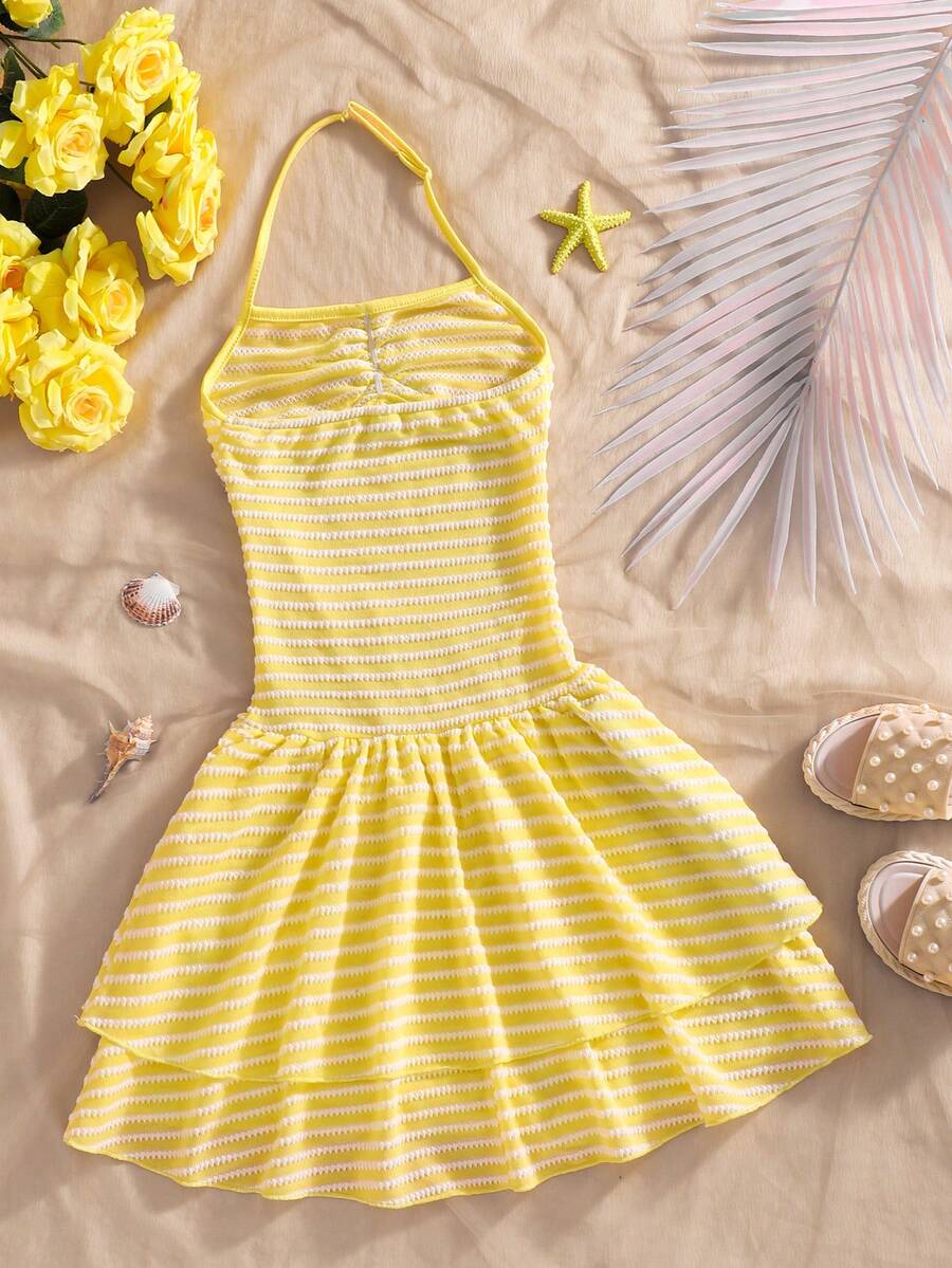 Tween girls apricot sleeveless halter mini dress with textured starfish and shell decor, shirred tiered layer, high waist, and flounce hem.