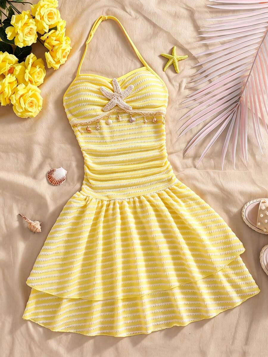 Tween girls apricot sleeveless halter mini dress with textured starfish and shell decor, shirred tiered layer, high waist, and flounce hem.