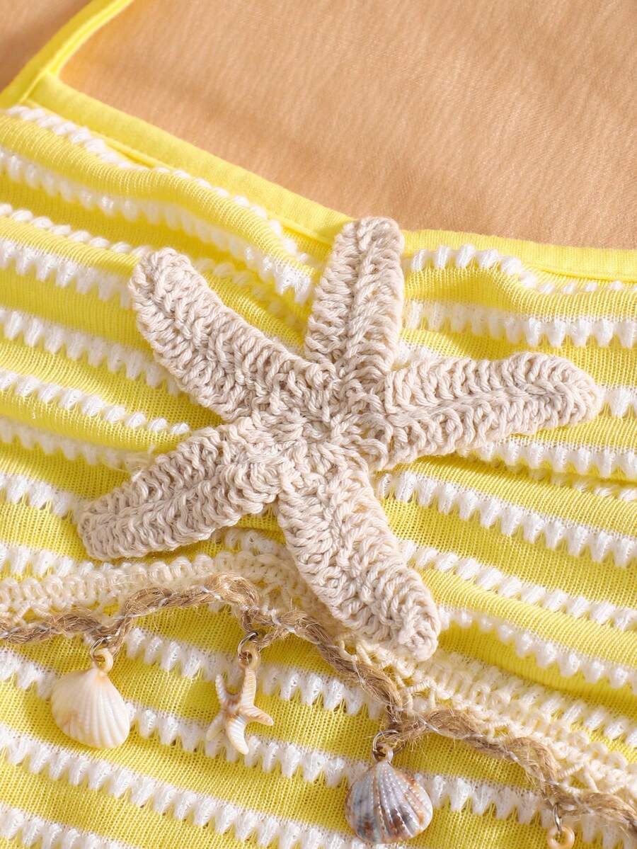 Tween girls apricot sleeveless halter mini dress with textured starfish and shell decor, shirred tiered layer, high waist, and flounce hem.
