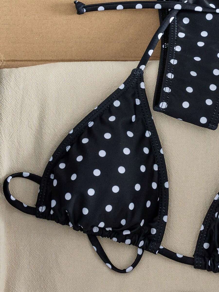 Women's striped halter two-piece swimsuit featuring a lace-up triangle top with removable padding and high-cut low-waist bikini bottoms.