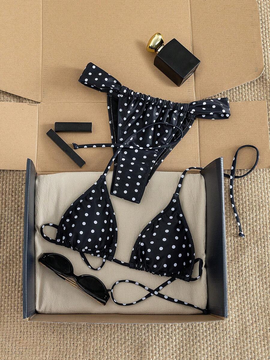 Women's striped halter two-piece swimsuit featuring a lace-up triangle top with removable padding and high-cut low-waist bikini bottoms.
