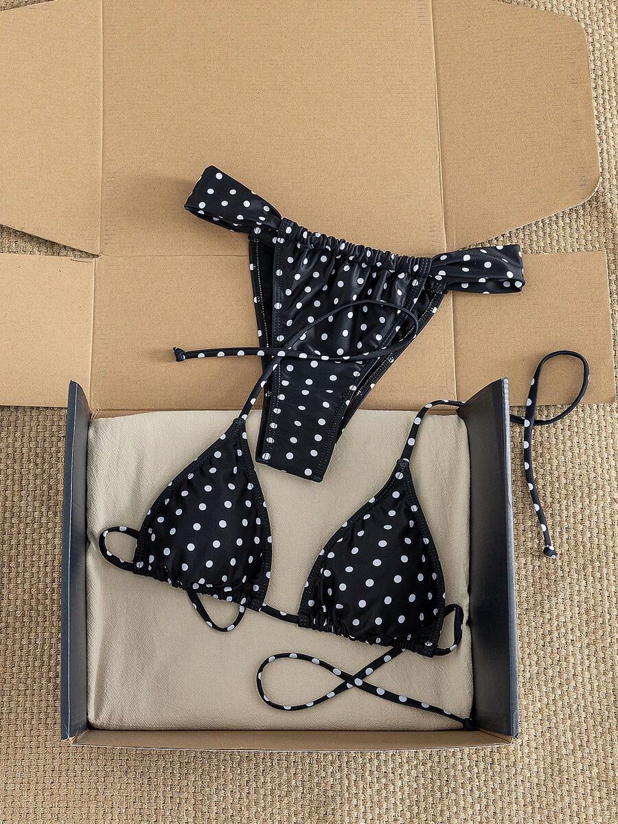 Women's striped halter two-piece swimsuit featuring a lace-up triangle top with removable padding and high-cut low-waist bikini bottoms.