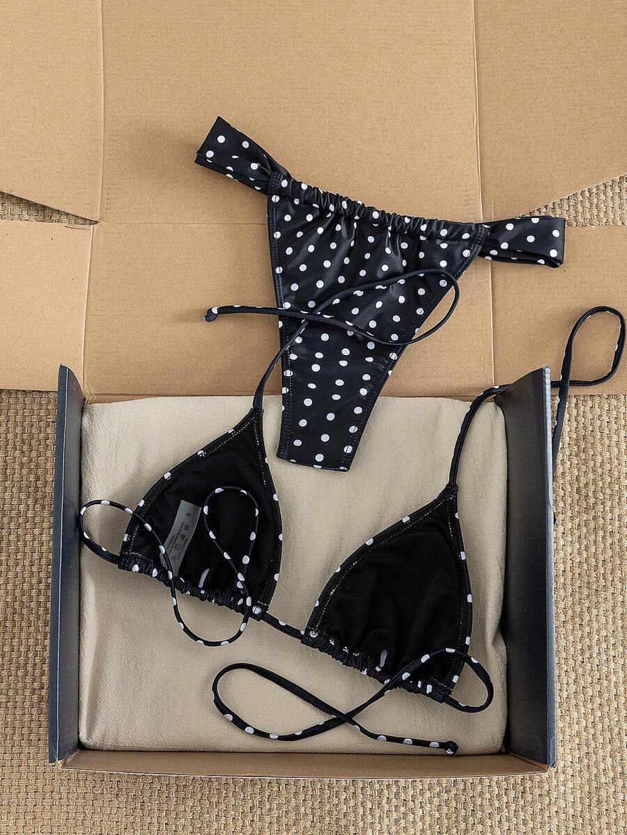 Women's striped halter two-piece swimsuit featuring a lace-up triangle top with removable padding and high-cut low-waist bikini bottoms.