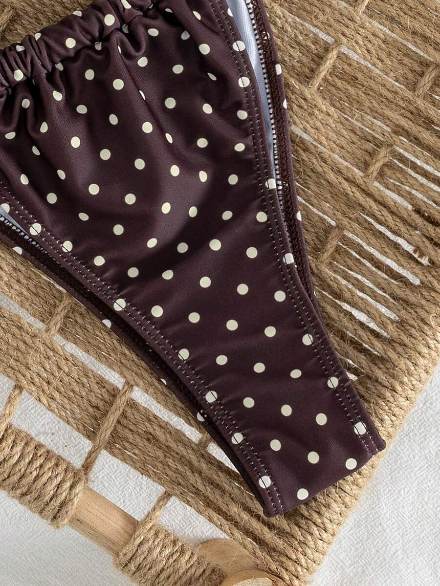 Women's striped halter two-piece swimsuit featuring a lace-up triangle top with removable padding and high-cut low-waist bikini bottoms.