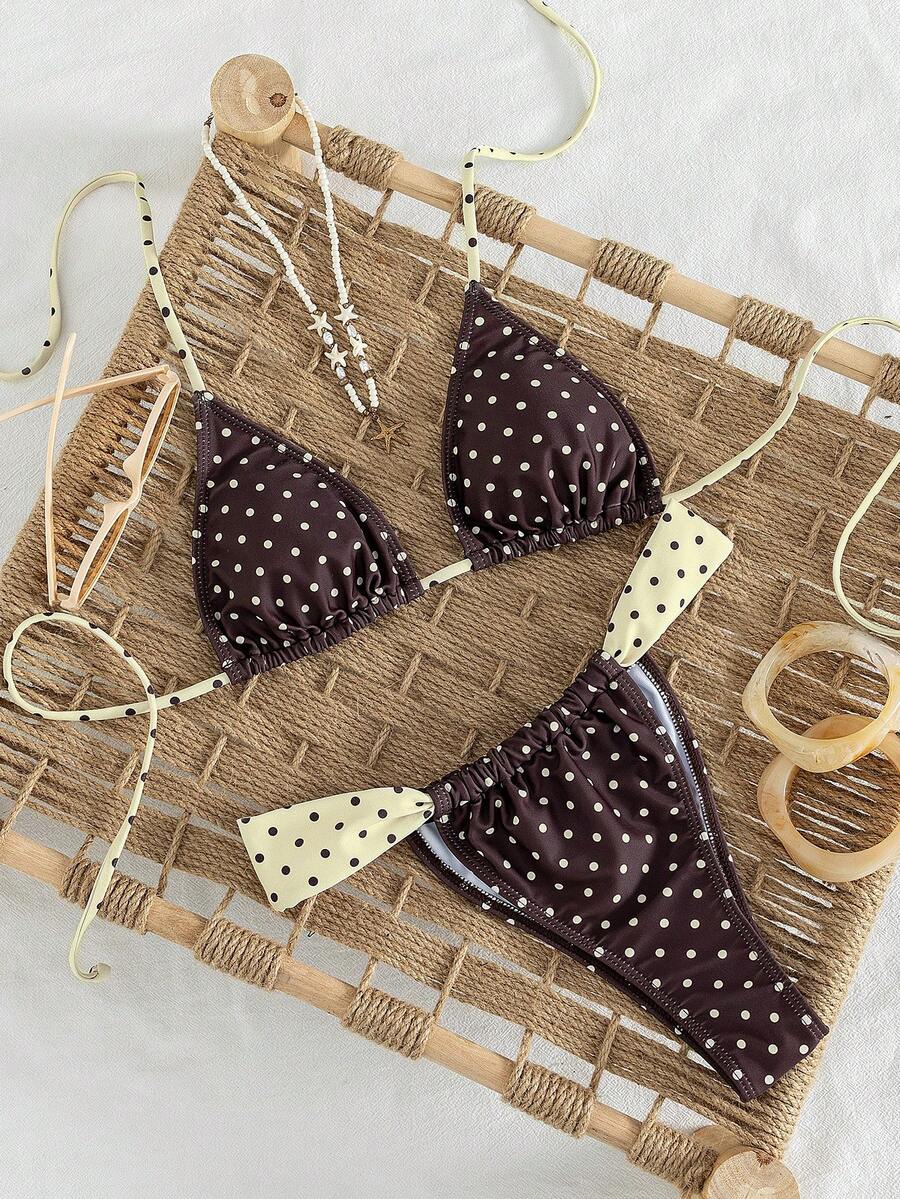 Women's striped halter two-piece swimsuit featuring a lace-up triangle top with removable padding and high-cut low-waist bikini bottoms.
