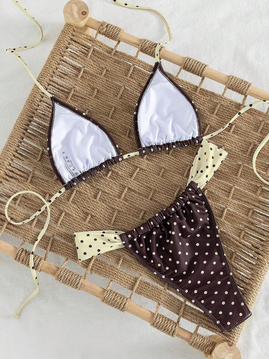 Women's striped halter two-piece swimsuit featuring a lace-up triangle top with removable padding and high-cut low-waist bikini bottoms.