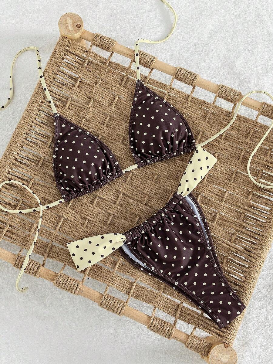 Women's striped halter two-piece swimsuit featuring a lace-up triangle top with removable padding and high-cut low-waist bikini bottoms.