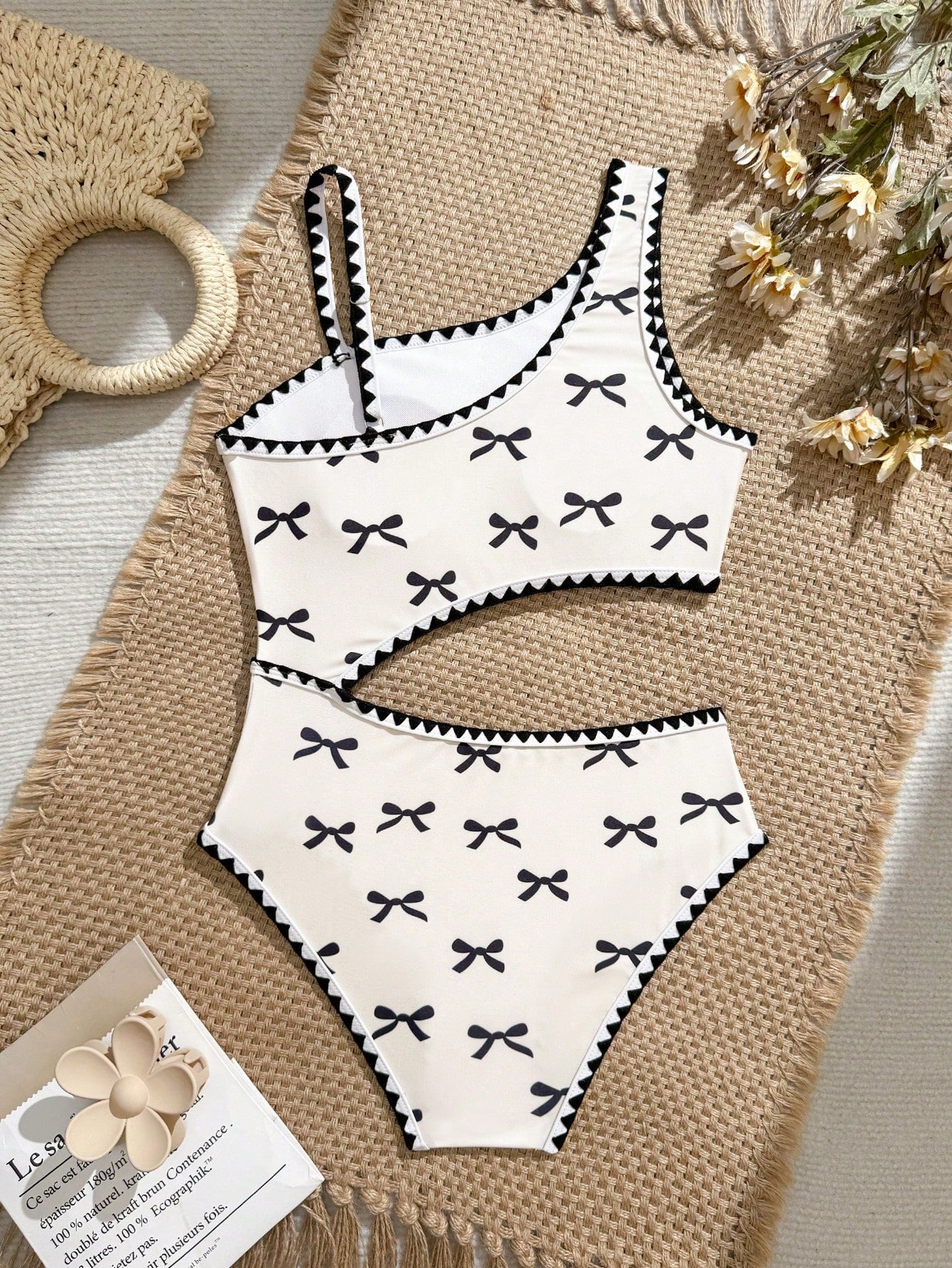 Tween girls one-piece swimsuit featuring an asymmetric neckline, pendant decor, plain design, wireless bra, high-cut bottom, and medium-stretch fabric.