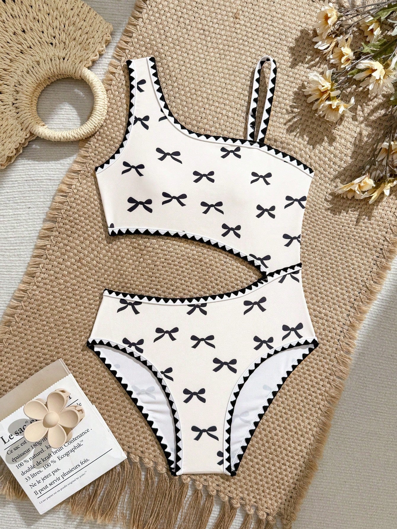 Tween girls one-piece swimsuit featuring an asymmetric neckline, pendant decor, plain design, wireless bra, high-cut bottom, and medium-stretch fabric.
