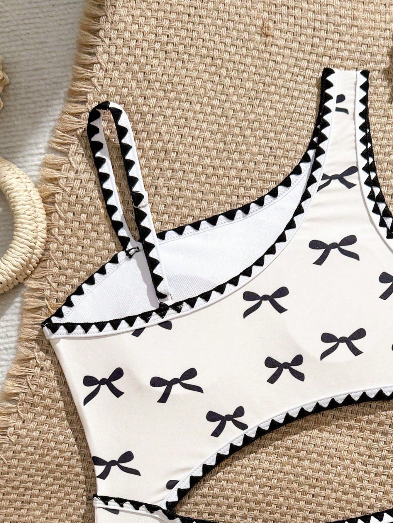 Tween girls one-piece swimsuit featuring an asymmetric neckline, pendant decor, plain design, wireless bra, high-cut bottom, and medium-stretch fabric.