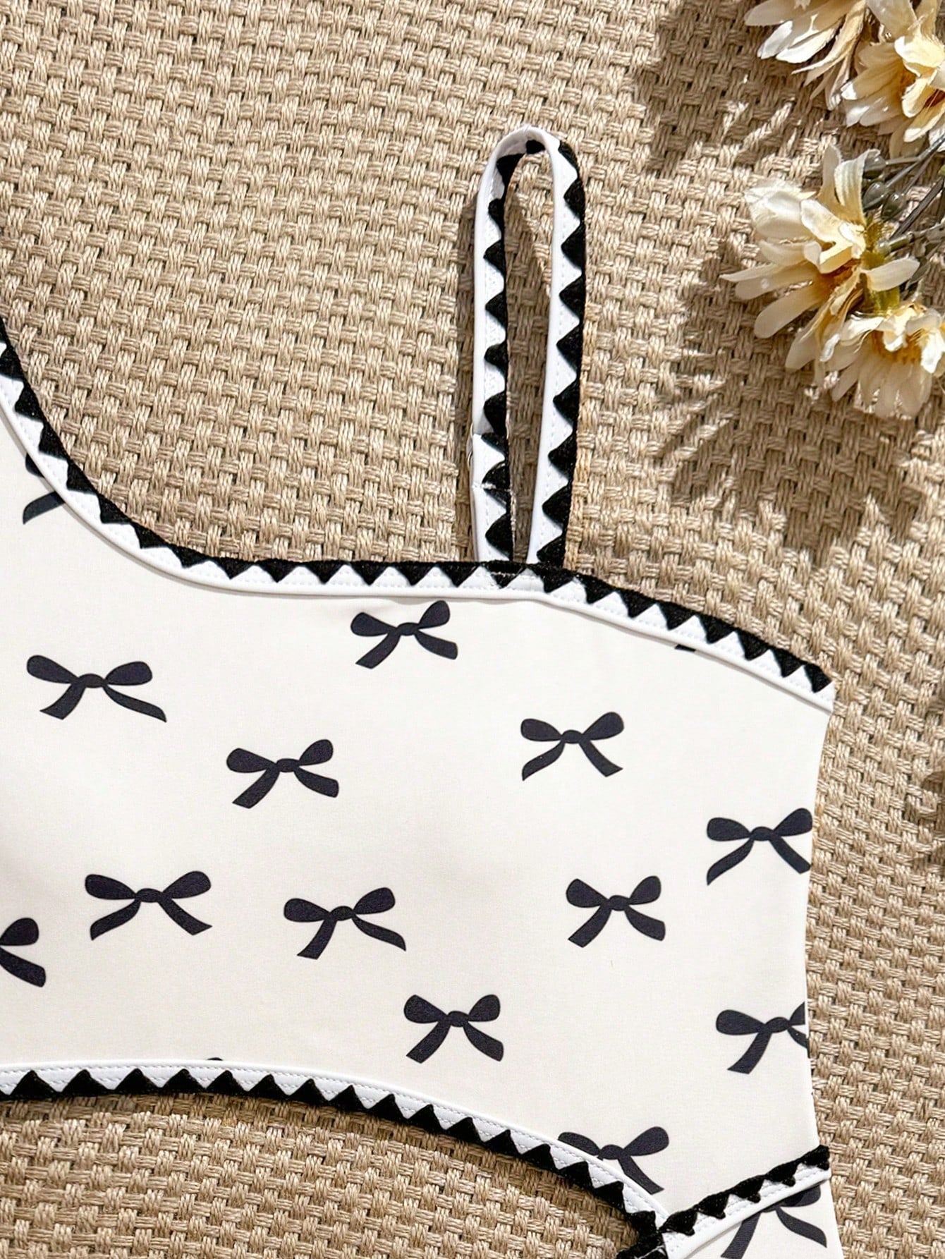 Tween girls one-piece swimsuit featuring an asymmetric neckline, pendant decor, plain design, wireless bra, high-cut bottom, and medium-stretch fabric.