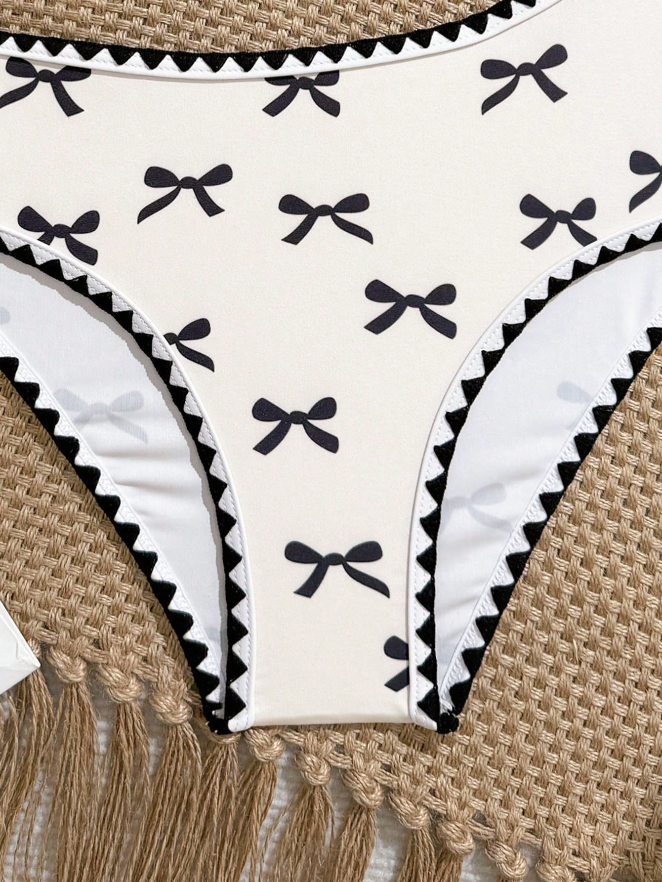 Tween girls one-piece swimsuit featuring an asymmetric neckline, pendant decor, plain design, wireless bra, high-cut bottom, and medium-stretch fabric.