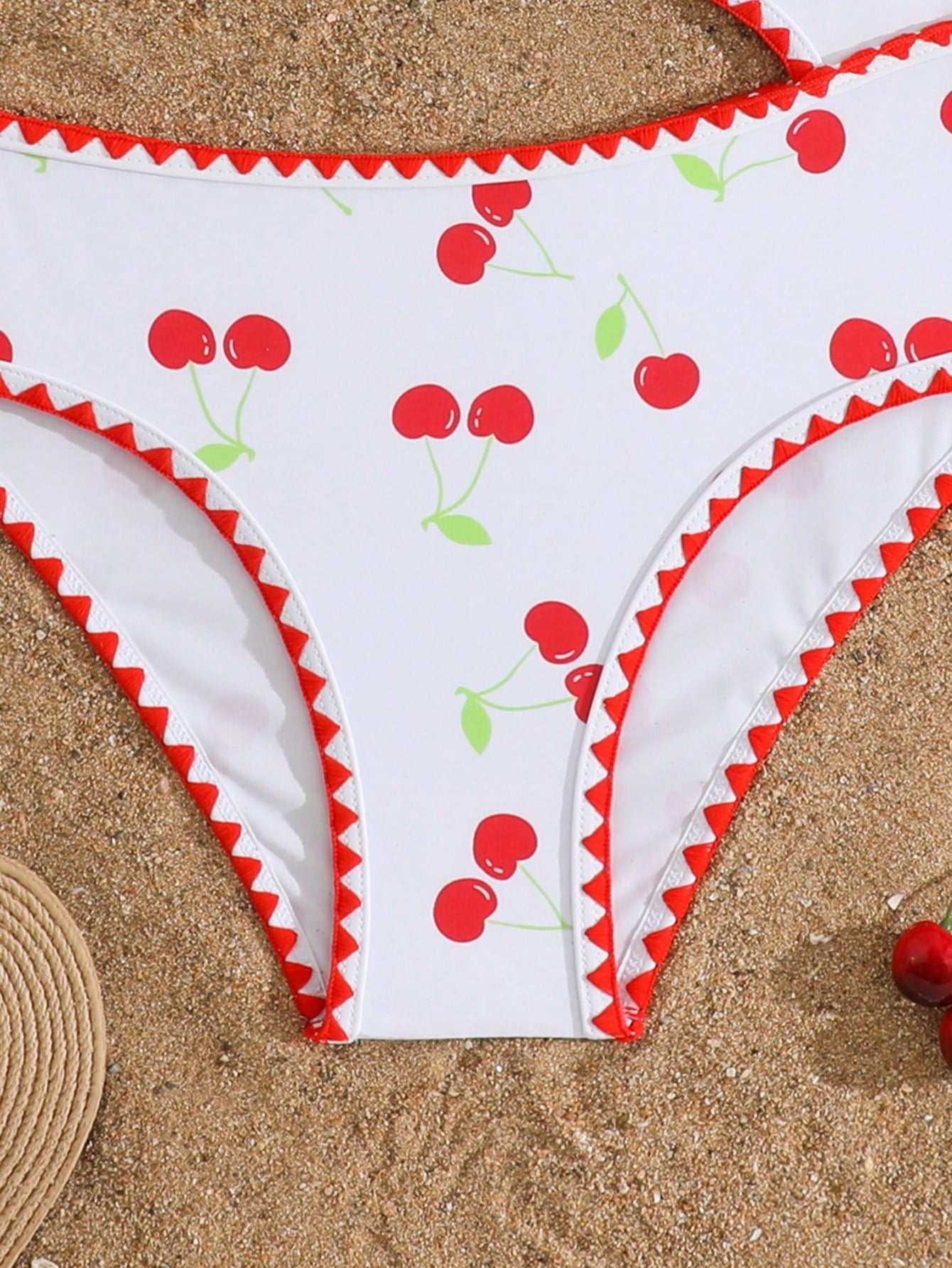 Tween girls one-piece swimsuit featuring an asymmetric neckline, pendant decor, plain design, wireless bra, high-cut bottom, and medium-stretch fabric.